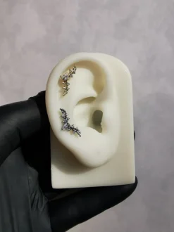 Tytanowa nakrętka cluster listki z białymi cyrkoniami - złoty - TNA-055