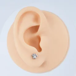 Tytanowy kolczyk labret złota łapka