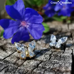 Tytanowy kolczyk labret złoty motylek z białymi cyrkoniami